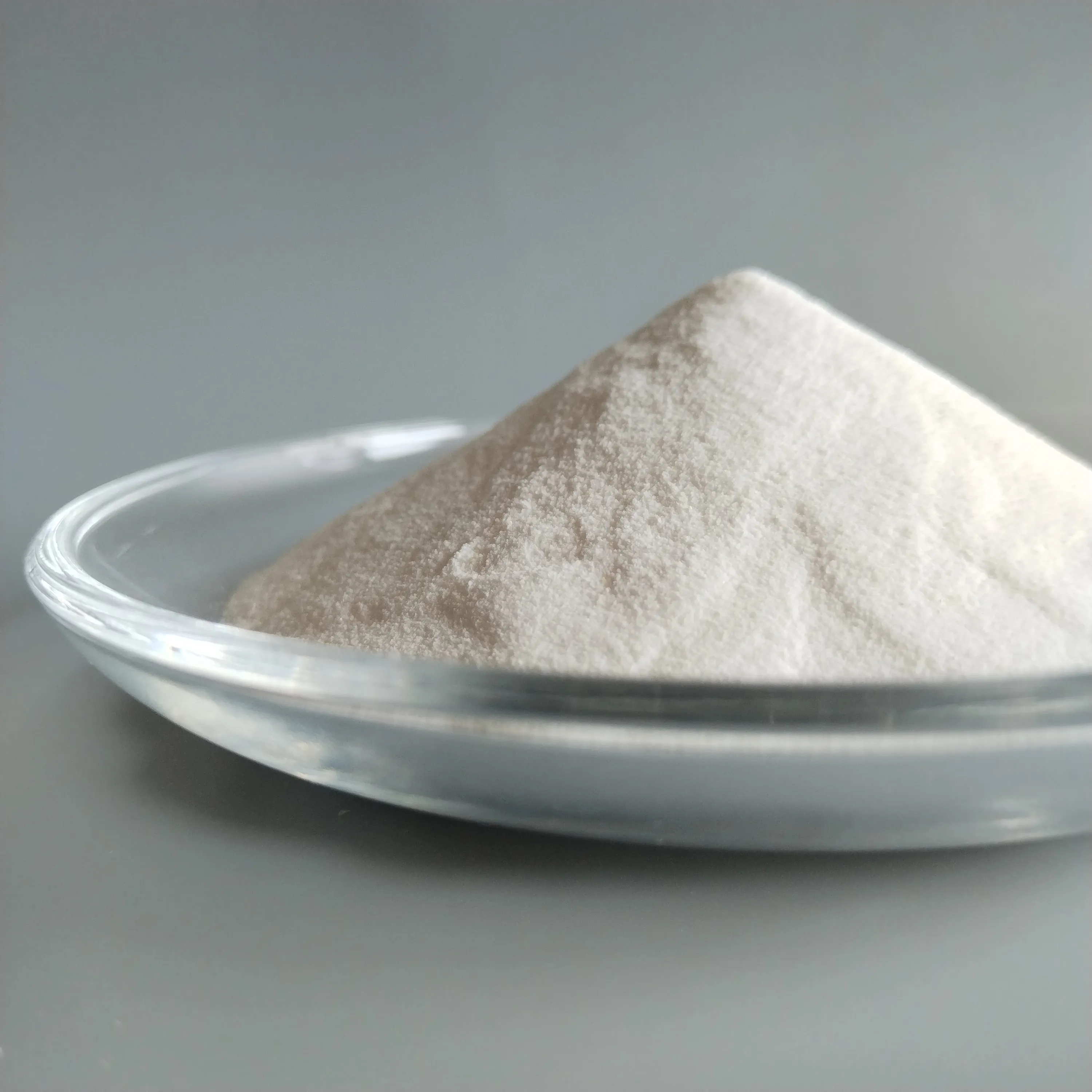close-up of PC-1006E white polycarboxylate superplasticizer powder for gypsum mortar and gypsum systems