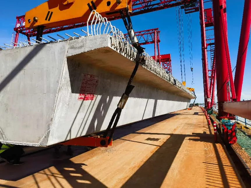 precast concrete beam being lifted for bridge and building structural installation