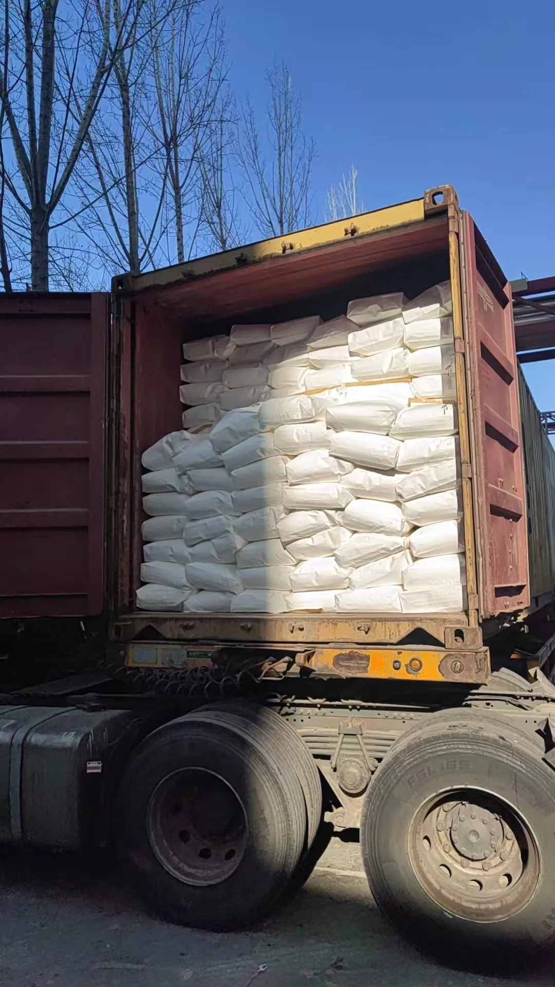 Bulk bags of EPEG polyether monomer loaded inside shipping container for export supply