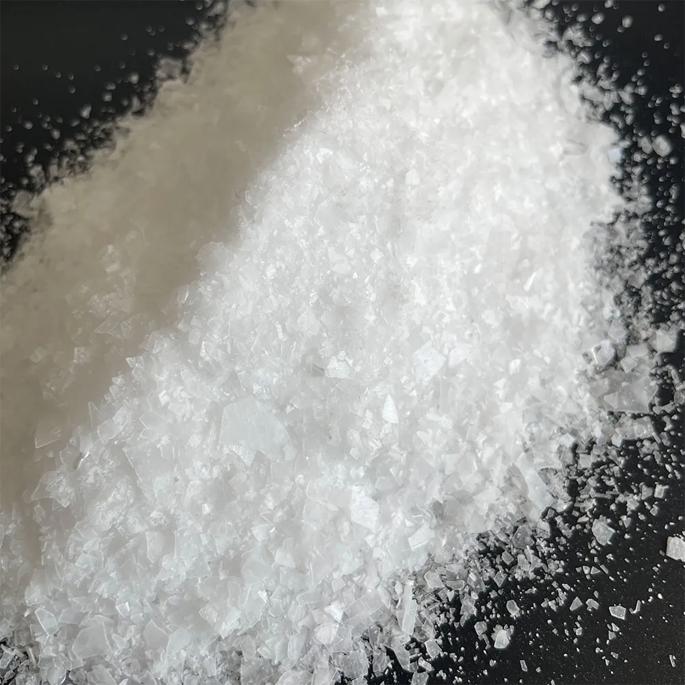 Close-up of white EPEG polyether monomer crystal flakes for polycarboxylate superplasticizer raw material