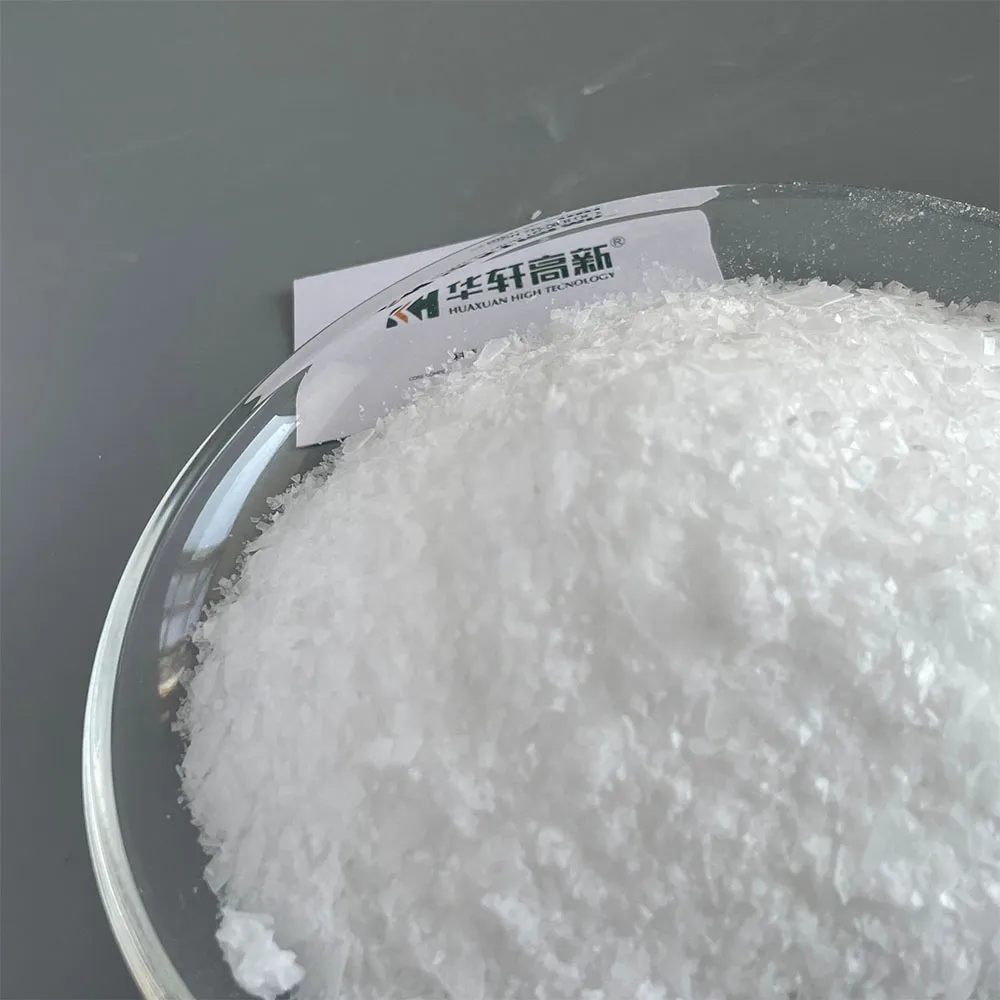 Close-up view of TPEG monomer crystal flakes for polycarboxylate water reducer production